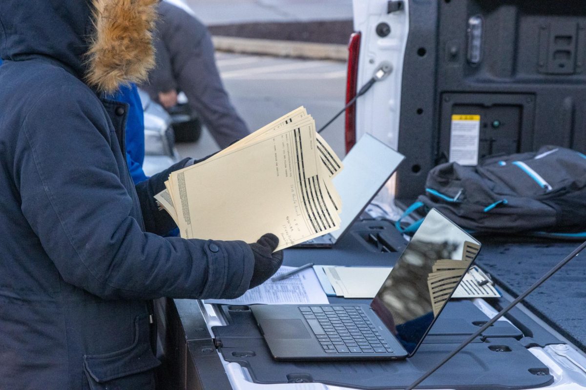 During the early morning oil changes, employees of Fusz work on getting paperwork settled.