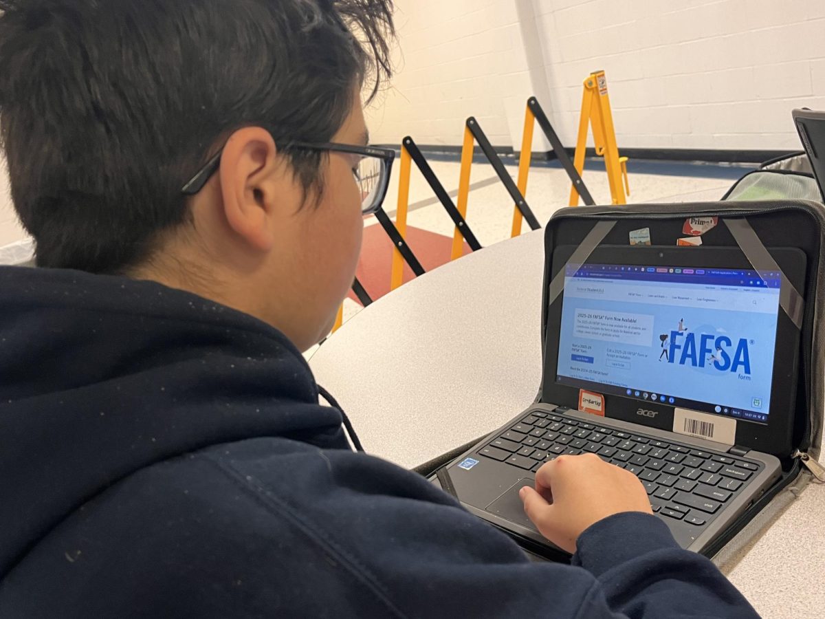 Zachary Jose (12) works on filling out the new FAFSA form for the 2025-2026 school year.