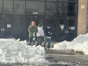 WSD maintenance staff shovel and prep the parking lots and sidewalks of Liberty High School after storm Blair on Tuesday, Jan. 7.