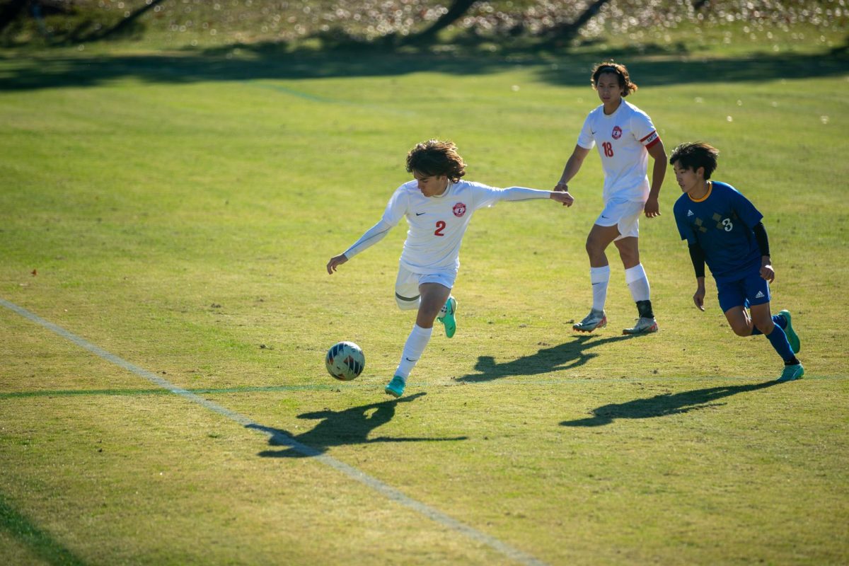 Cade "Piggy" Galaway winds up getting ready to kick the ball down the field in the state quarterfinals game.