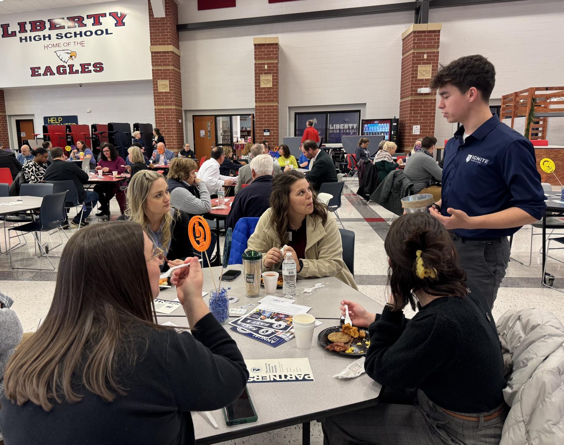 Former Liberty student Lucas Westhoff, talks to community members about the WSD Ignite program.