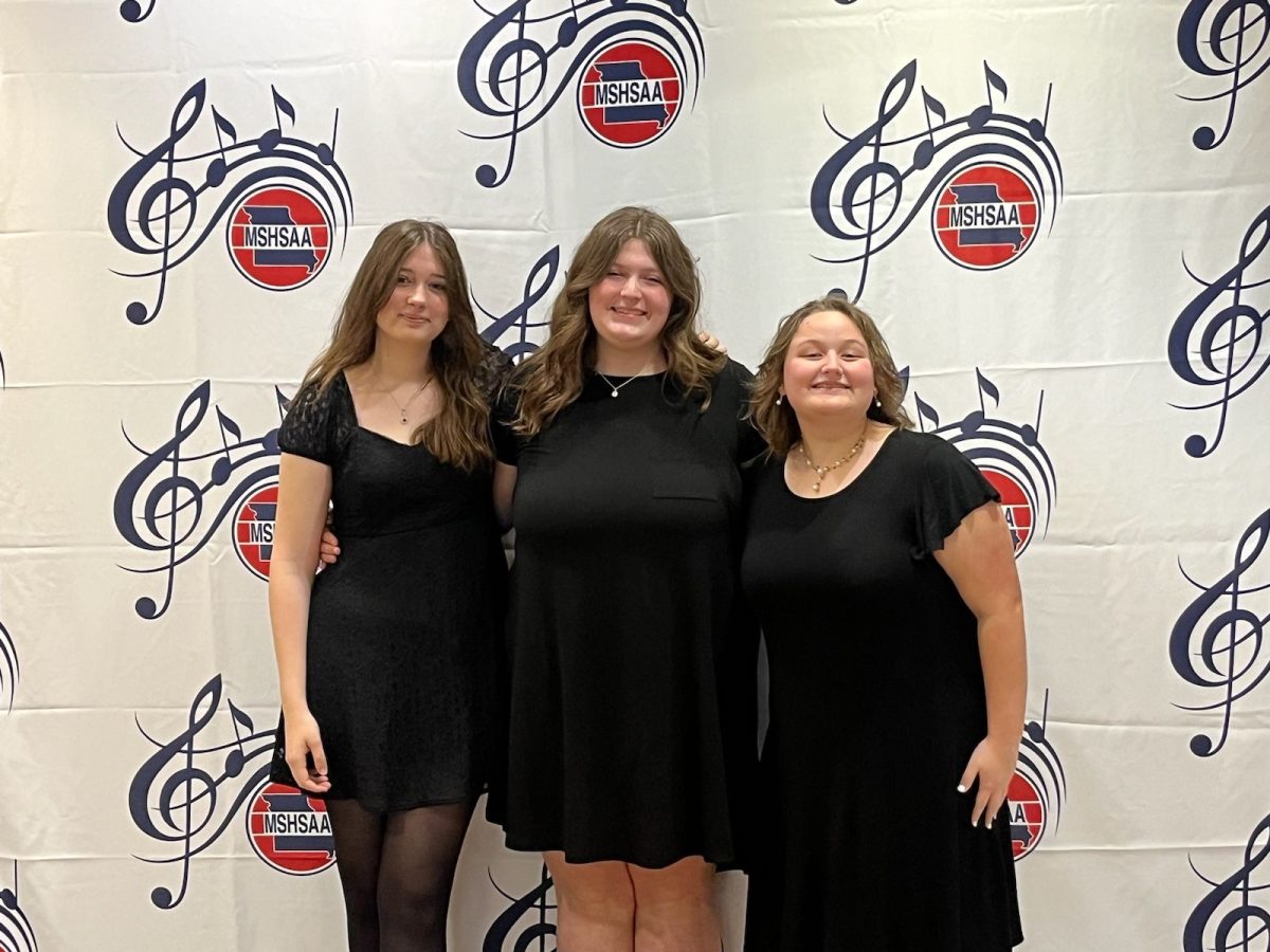 Keron Bowman (11), with Kylie Honerkamp (12), and Audrey Keller (12), at the 2024 state solo and small ensemble.