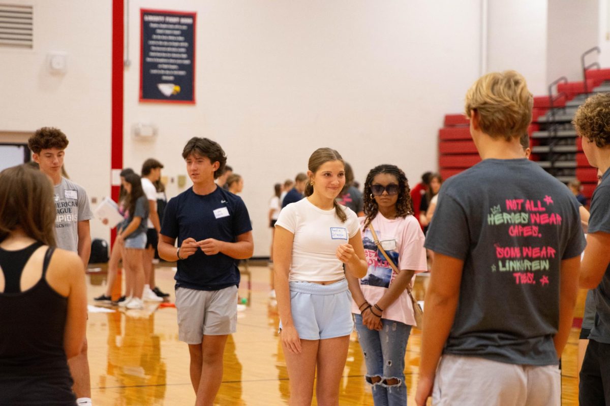 Amelia Ortmeyer (9) looks at Link Crew member during a game with group 9.