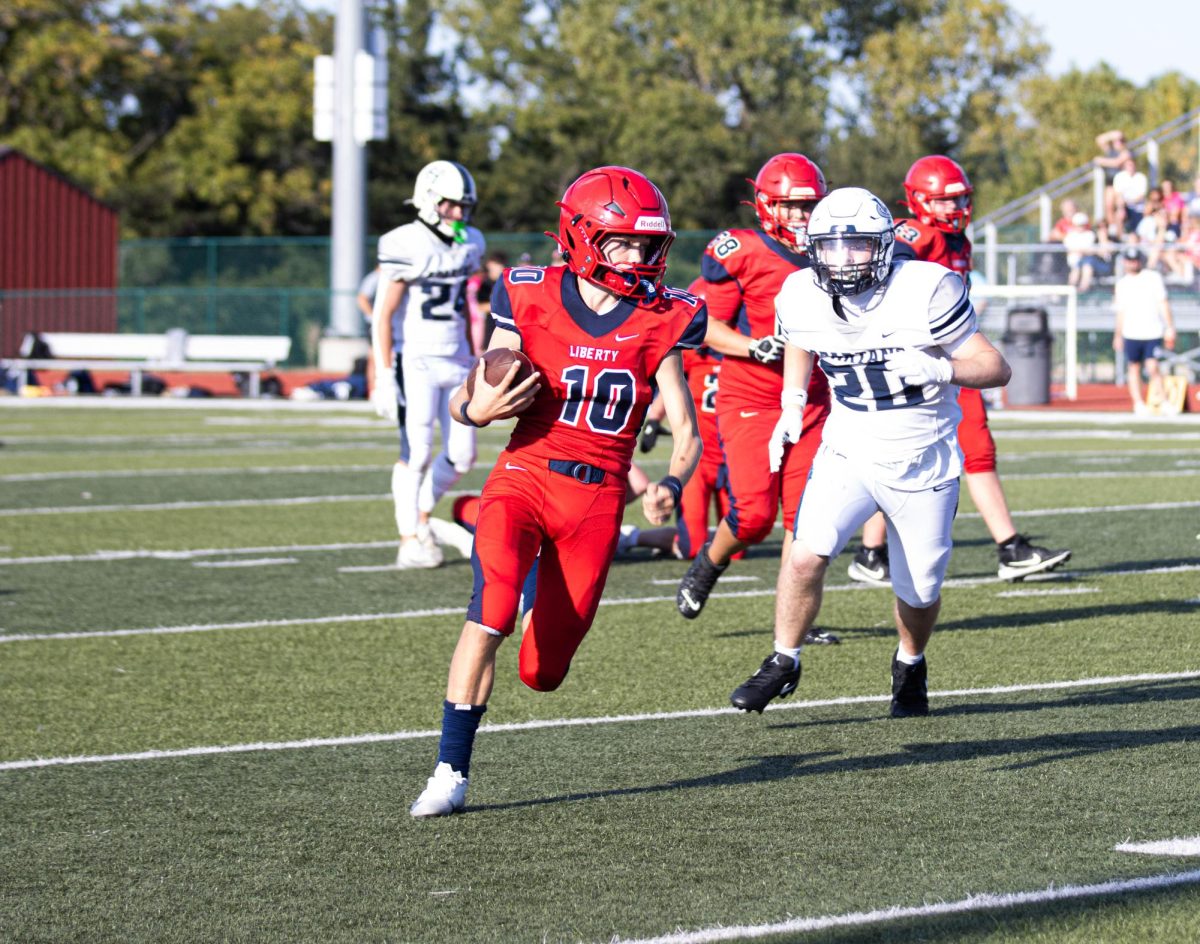 Langston LaBrot (9) runs up field in his first game against Howell Central. He rushed for three touchdowns and threw for one touchdown in the game.