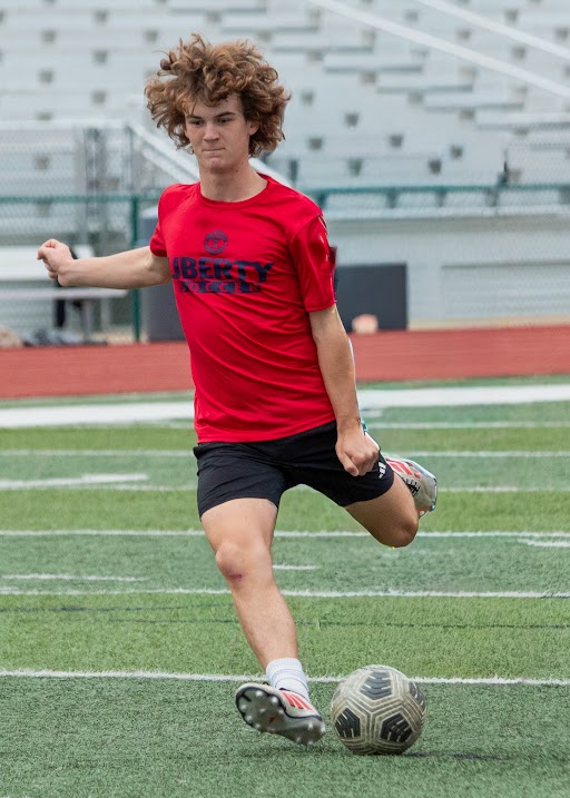 Jonah Chisholm(9) takes shot at practice