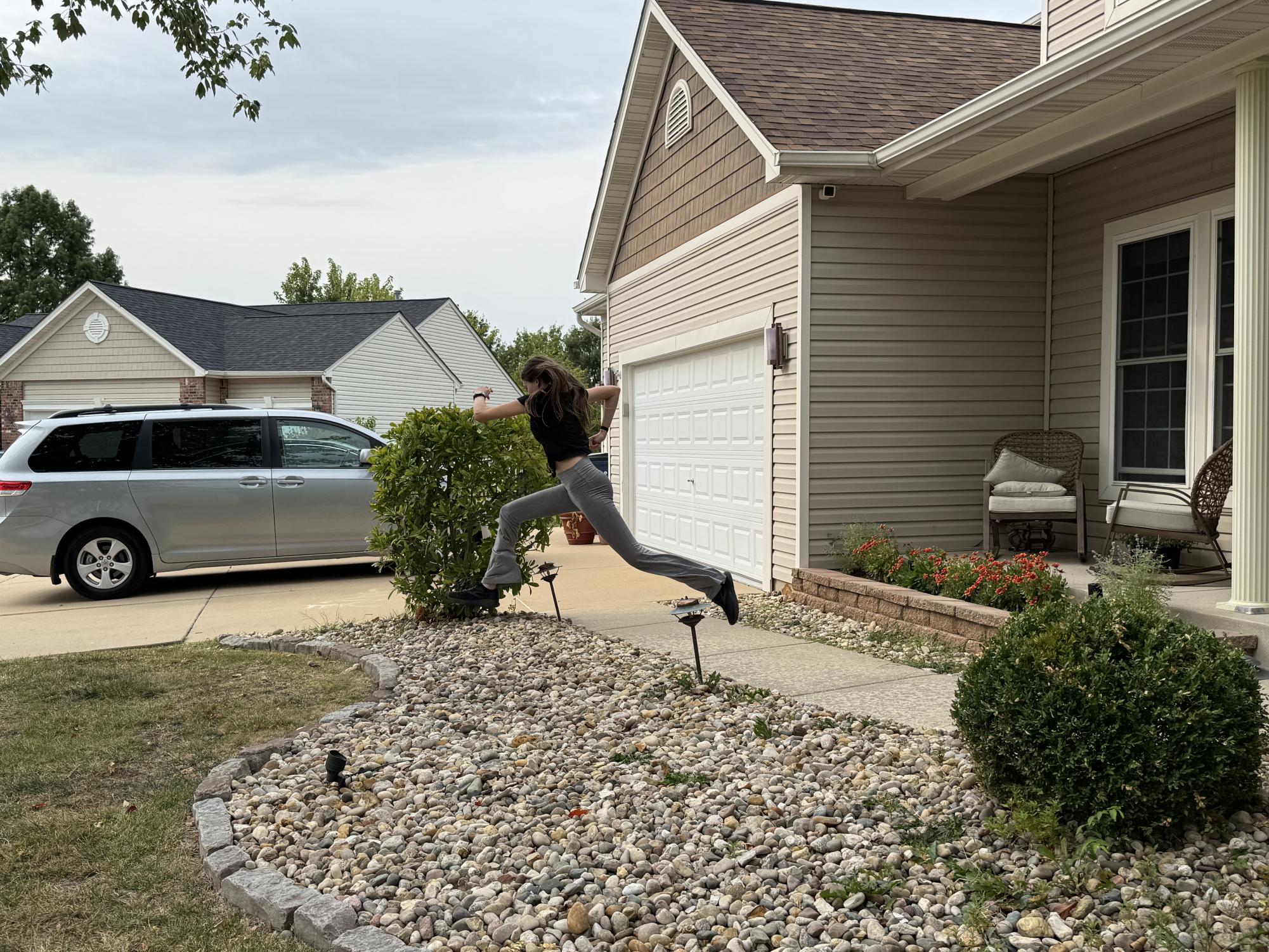 Kyla Burris (9) Jumps Off Of Neighbor's Porch During a Staged Ding Dong Ditch
