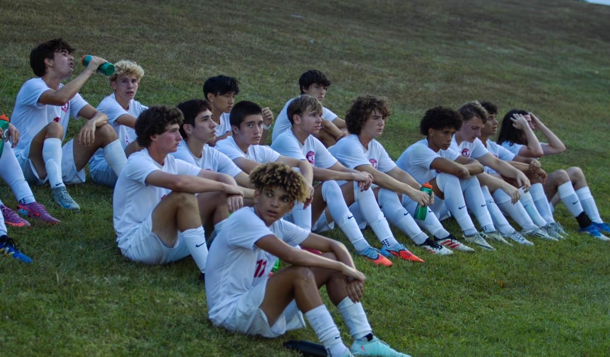 The boys varsity soccer team takes a rest during halftime vs Troy.