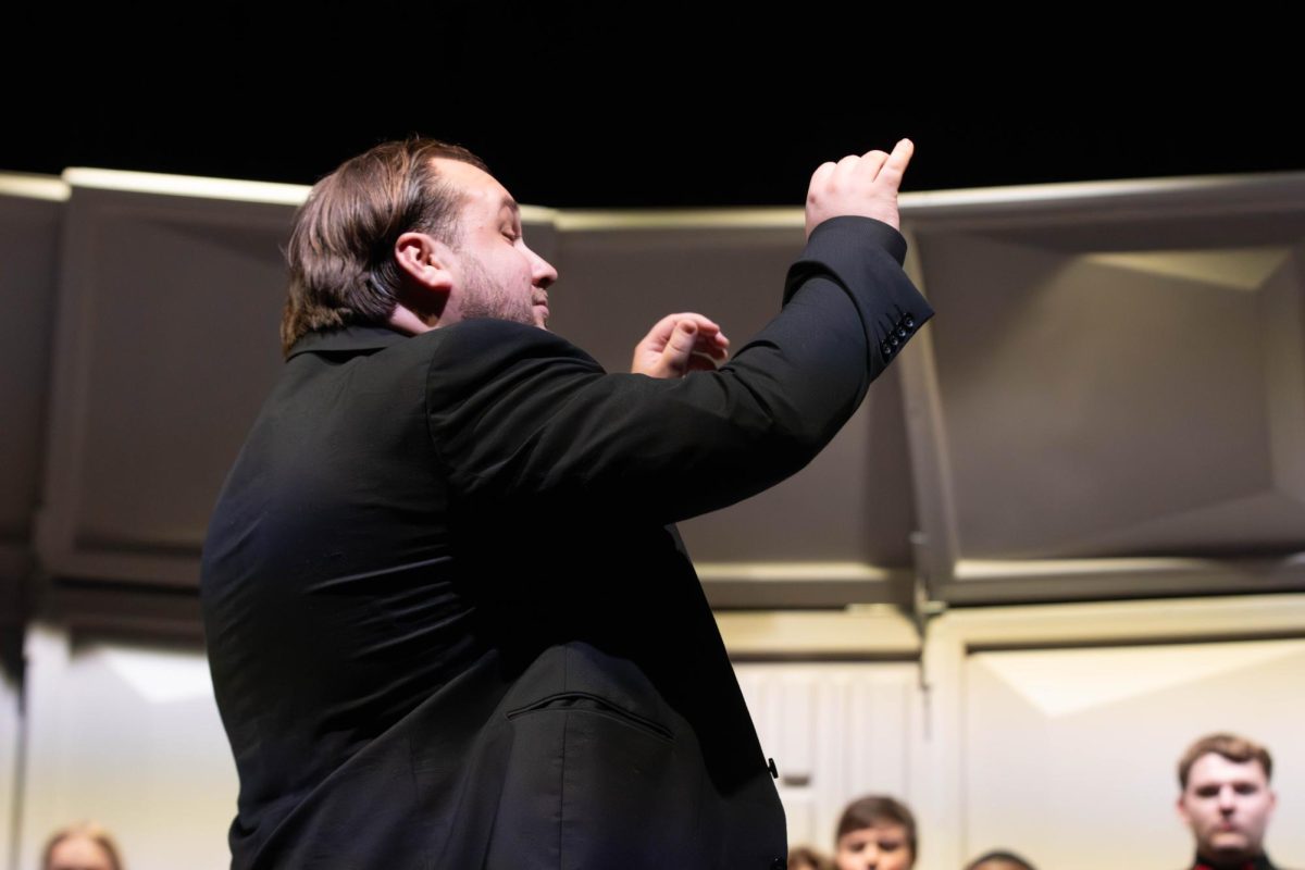 Carter Datz directs the first choir concert of the year, "Beginnings."  From the five choirs, there were a total of 71 students performing. Each choir sang three songs, with Treble and Concert being combined for two, and Baritone joining for a third.