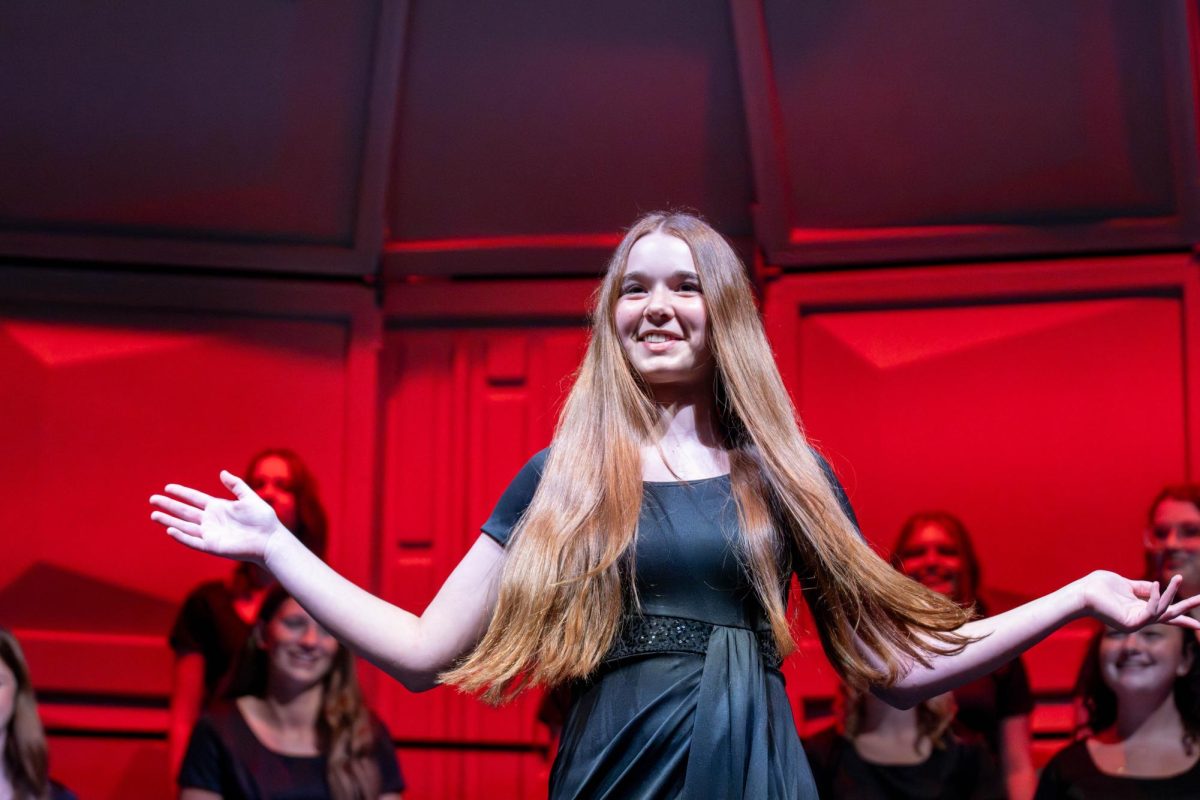Elly Rentfro (10) steps in front of the choir to perform her solo.