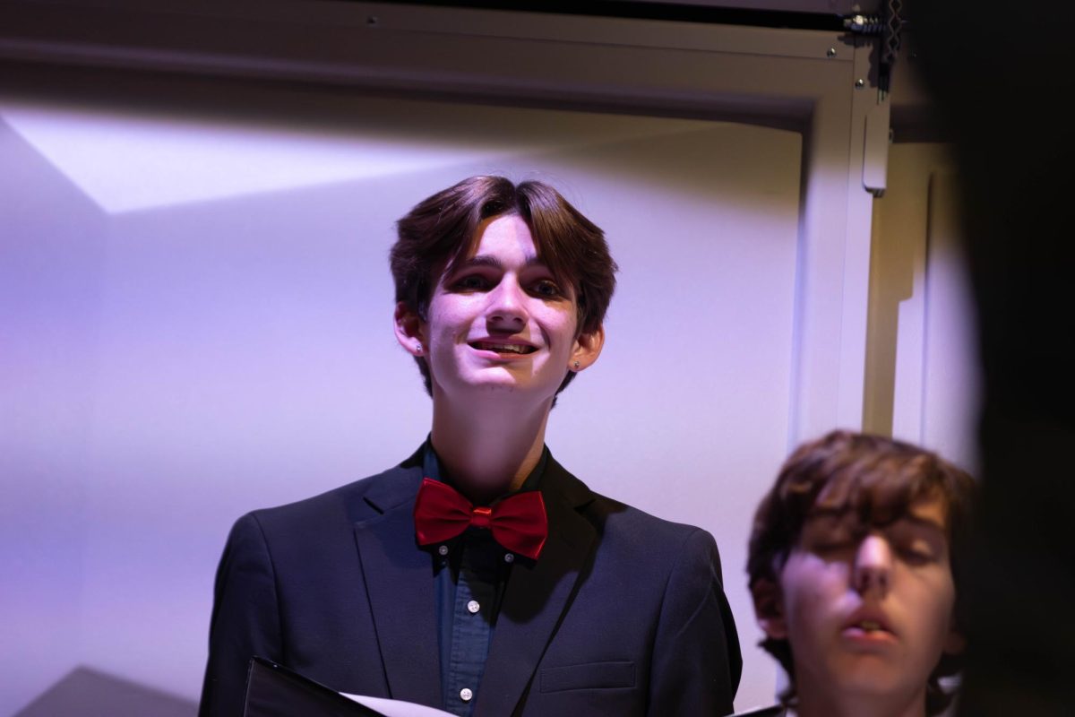 Sam Woolard (10) sings during Chamber Choir performance.