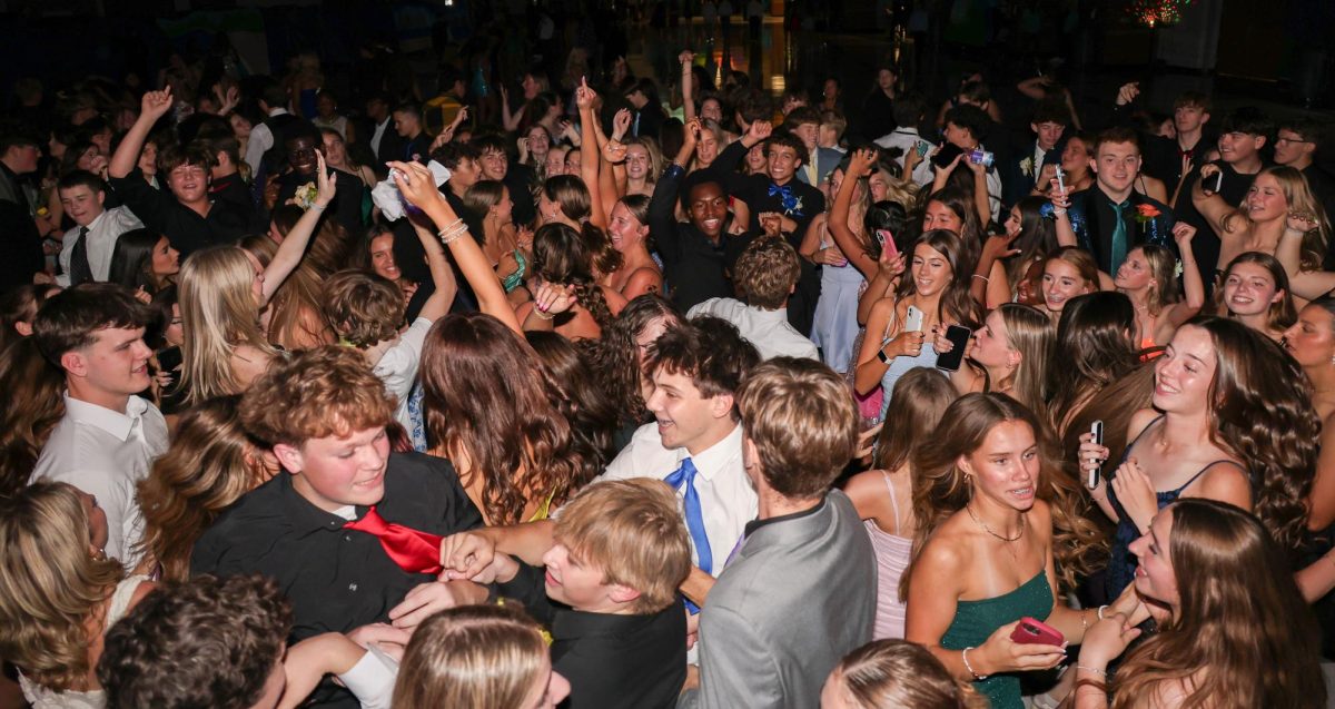 Students explain the pros and cons of attending the homecoming dance this year. 