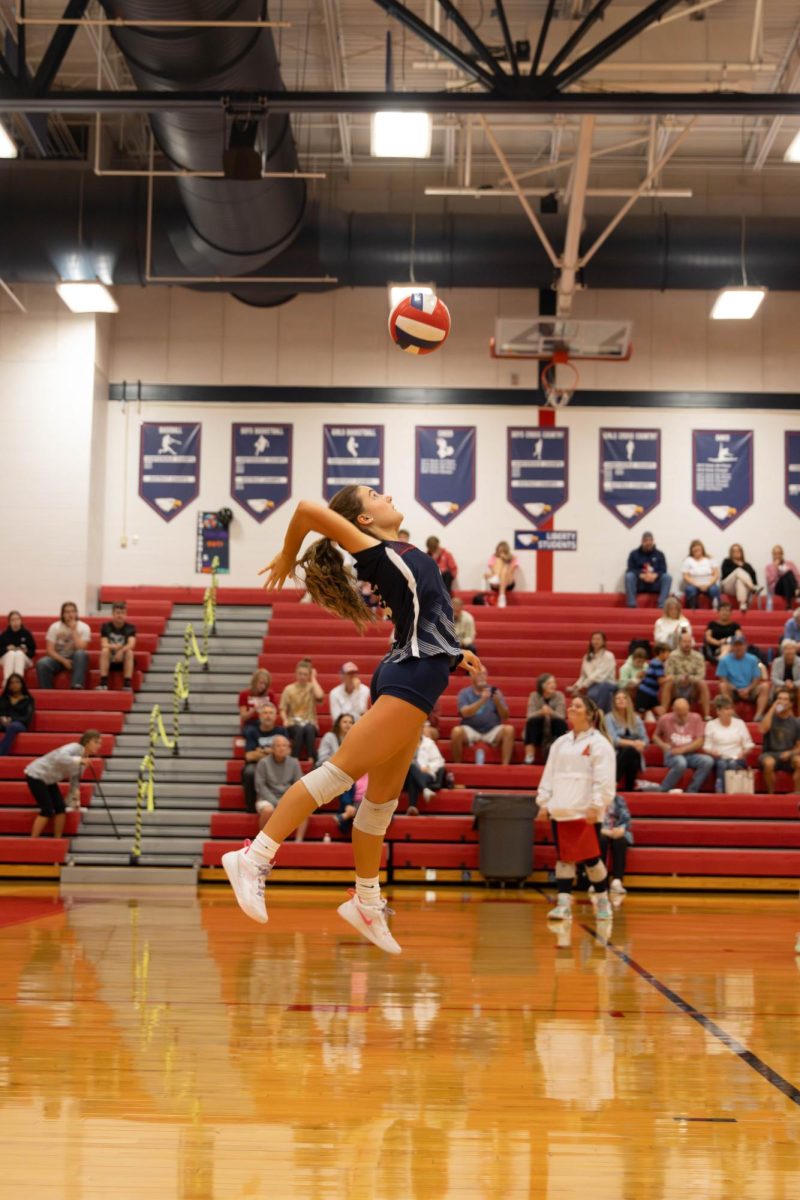 Matilda Nelson (10) sets the stakes high with her serves for JV volleyball,
