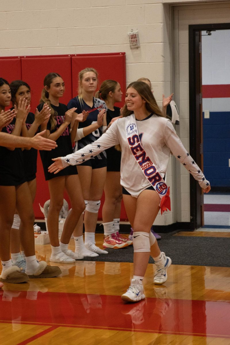 Hailey Jett (12) high fives teammates while making her way to head coach Veronica Kirkpatrick.