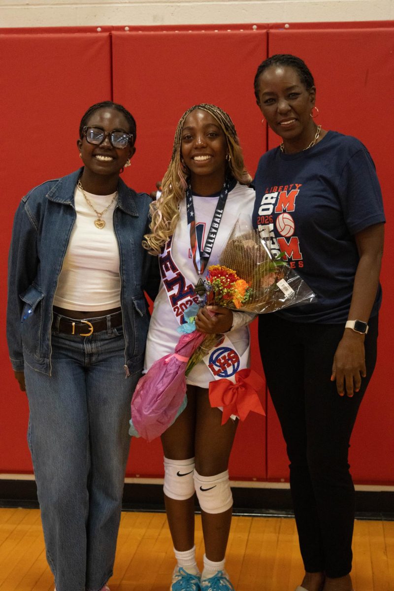 Tabitha Musangali (12) poses for photo with family.