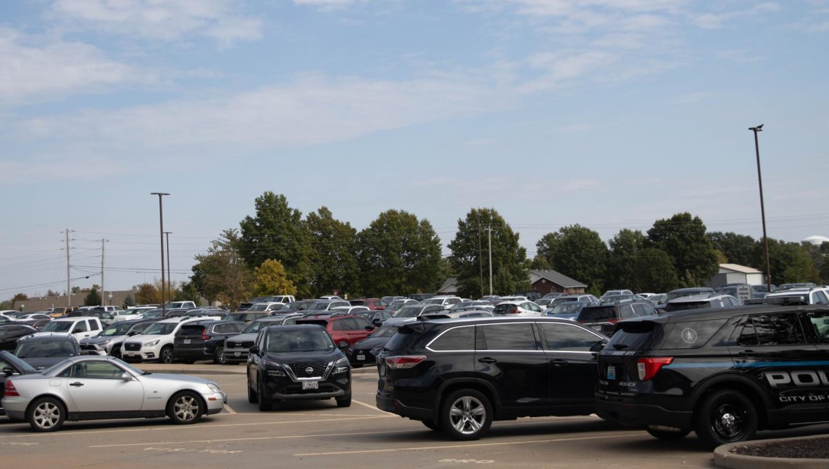 Liberty's parking lot during school hours is packed to the brim with cars that will later all have to pull out as the last bell rings.