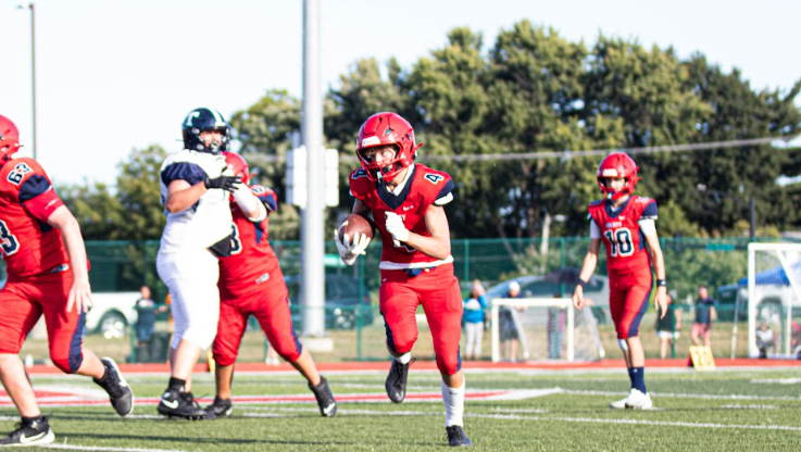 Rocky Clark (9) takes the handoff and makes a great effort to get a first down