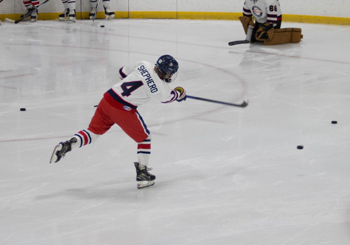 Blake Shepherd (9) scores a goal during warm ups in a game against Timberland. 