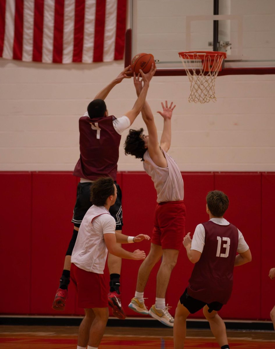 Landon Johnson (12) blocks a shot form the opposing team.