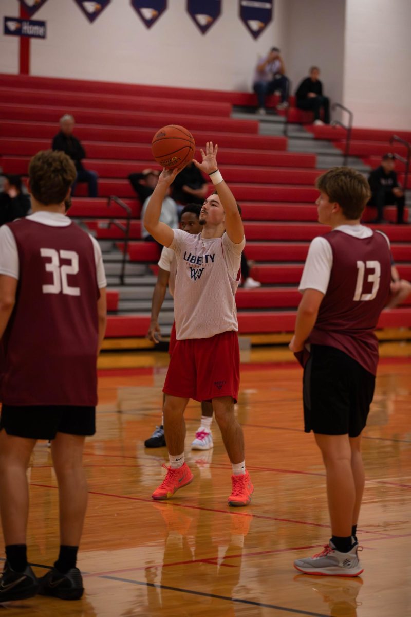 Tyler Cook (12) shoots a free throw.