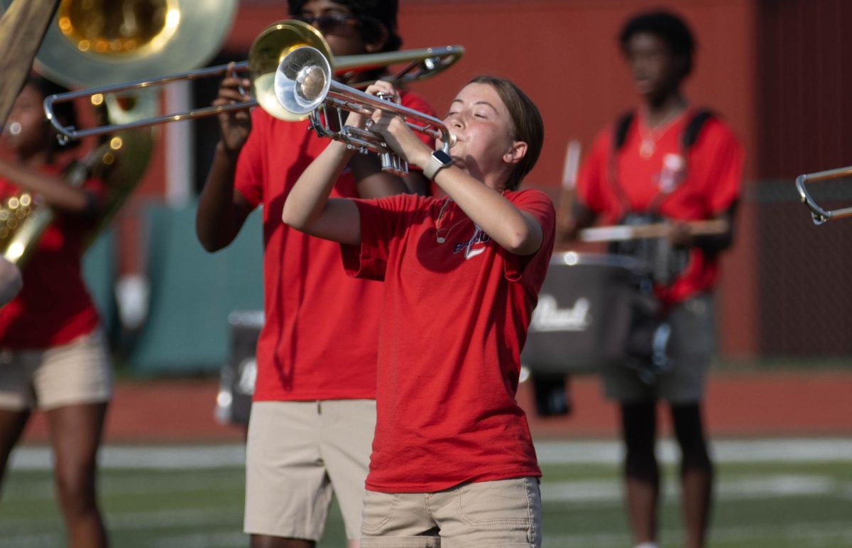 Elizabeth Simon (11) is playing her trumpet at the Parent Preview.