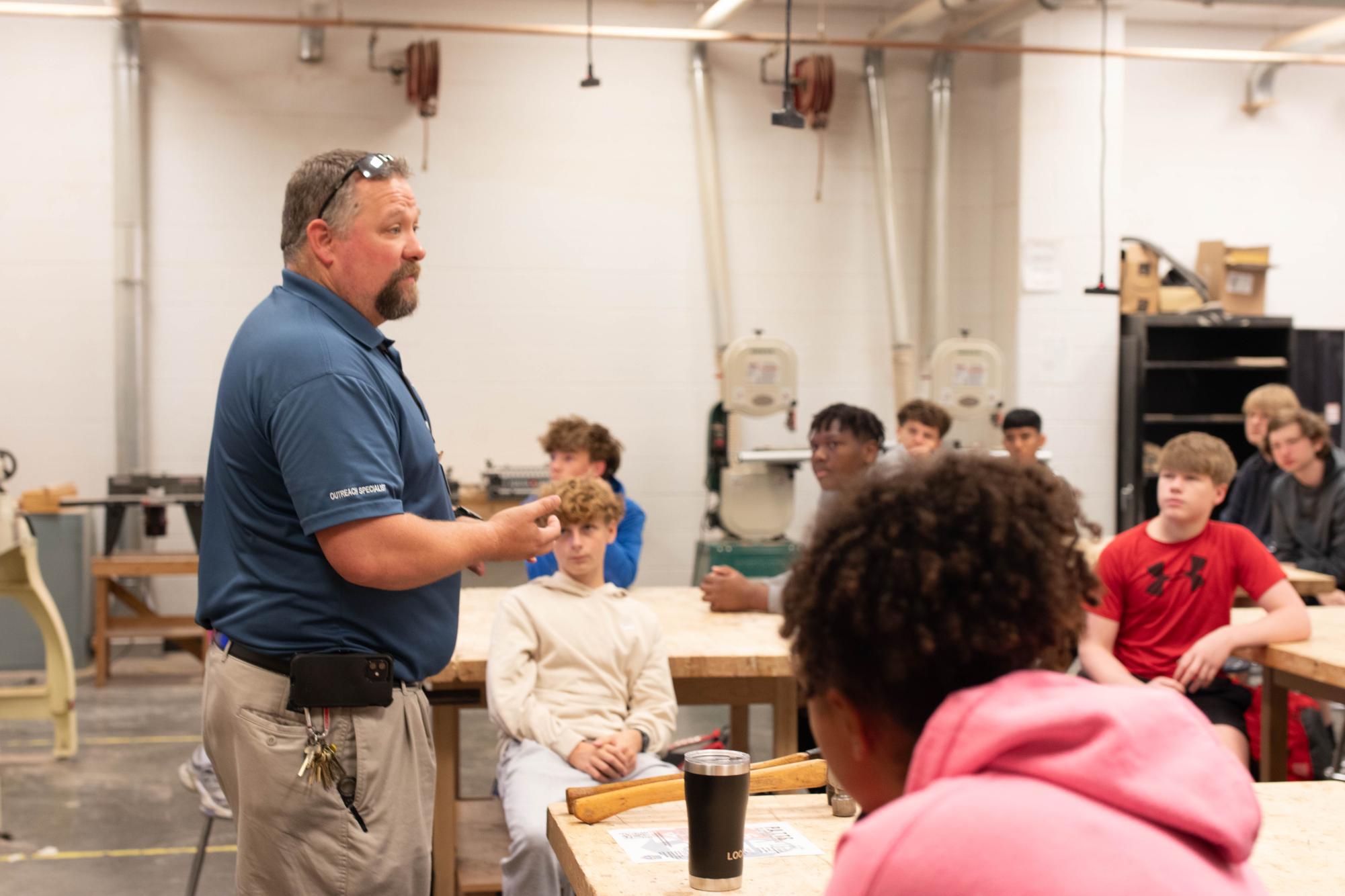 Chris Adair with the carpenter's union speaks about a career in trades to Joshua Galati's wood tech class.