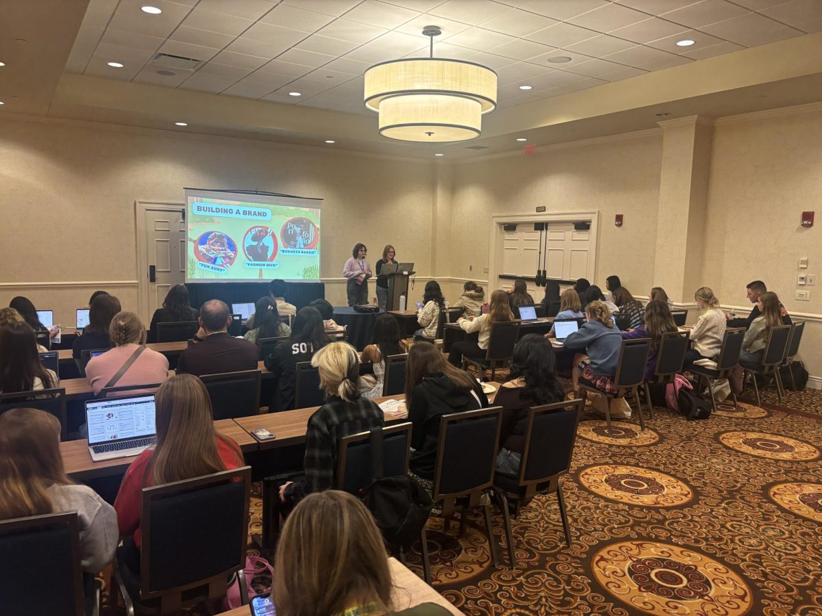 Ella Quinney (12) and Meghan Lynch (12) present their slideshow on magazine at their session.