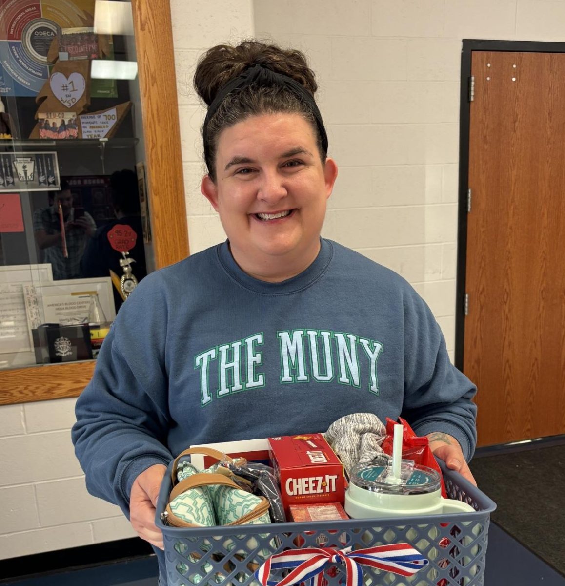 Mrs. Gehrke gratefully holds the basket of treats she has been given for receiving Teacher of the Year. 