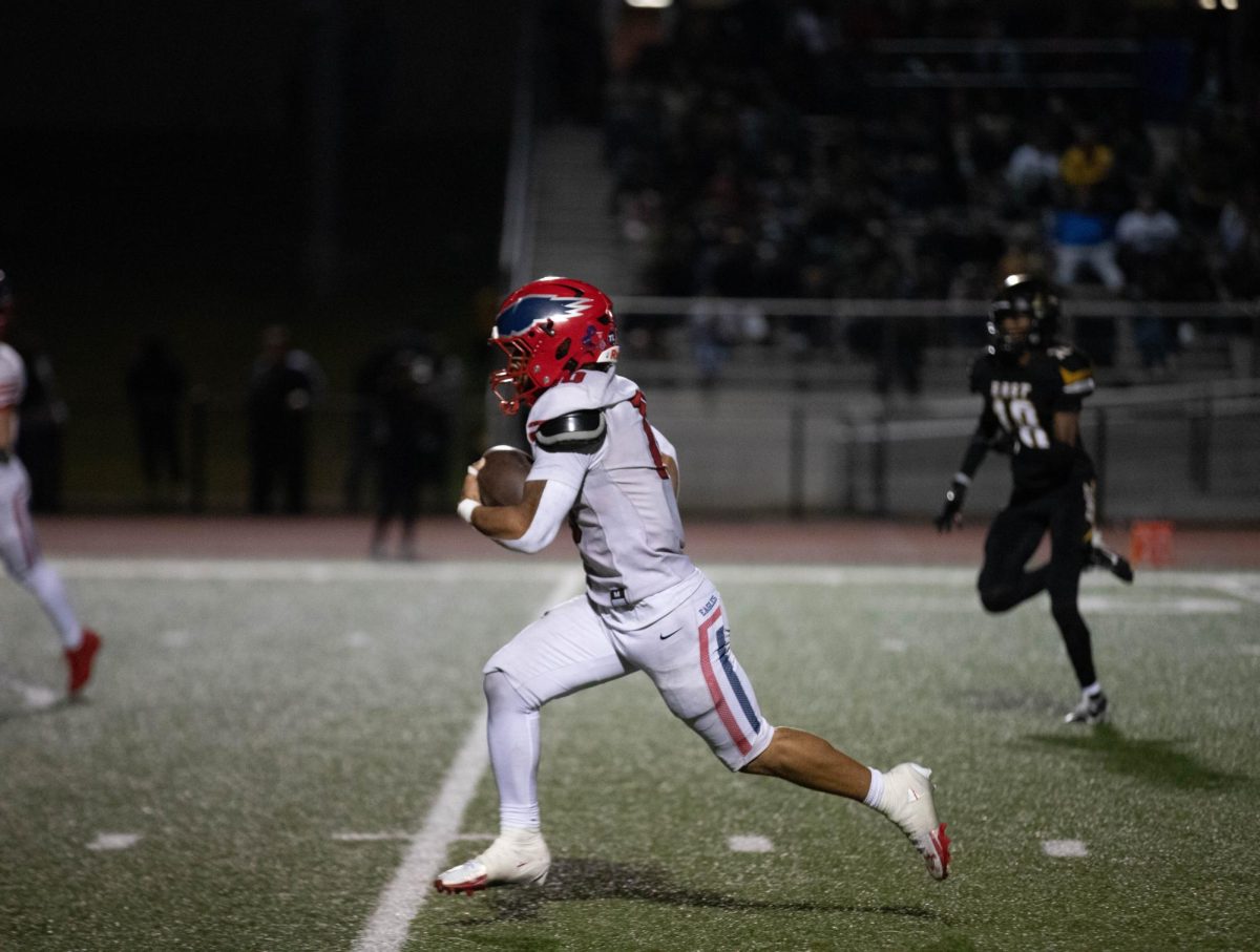 Jaylen Mack (12) runs towards the end zone in the open field.