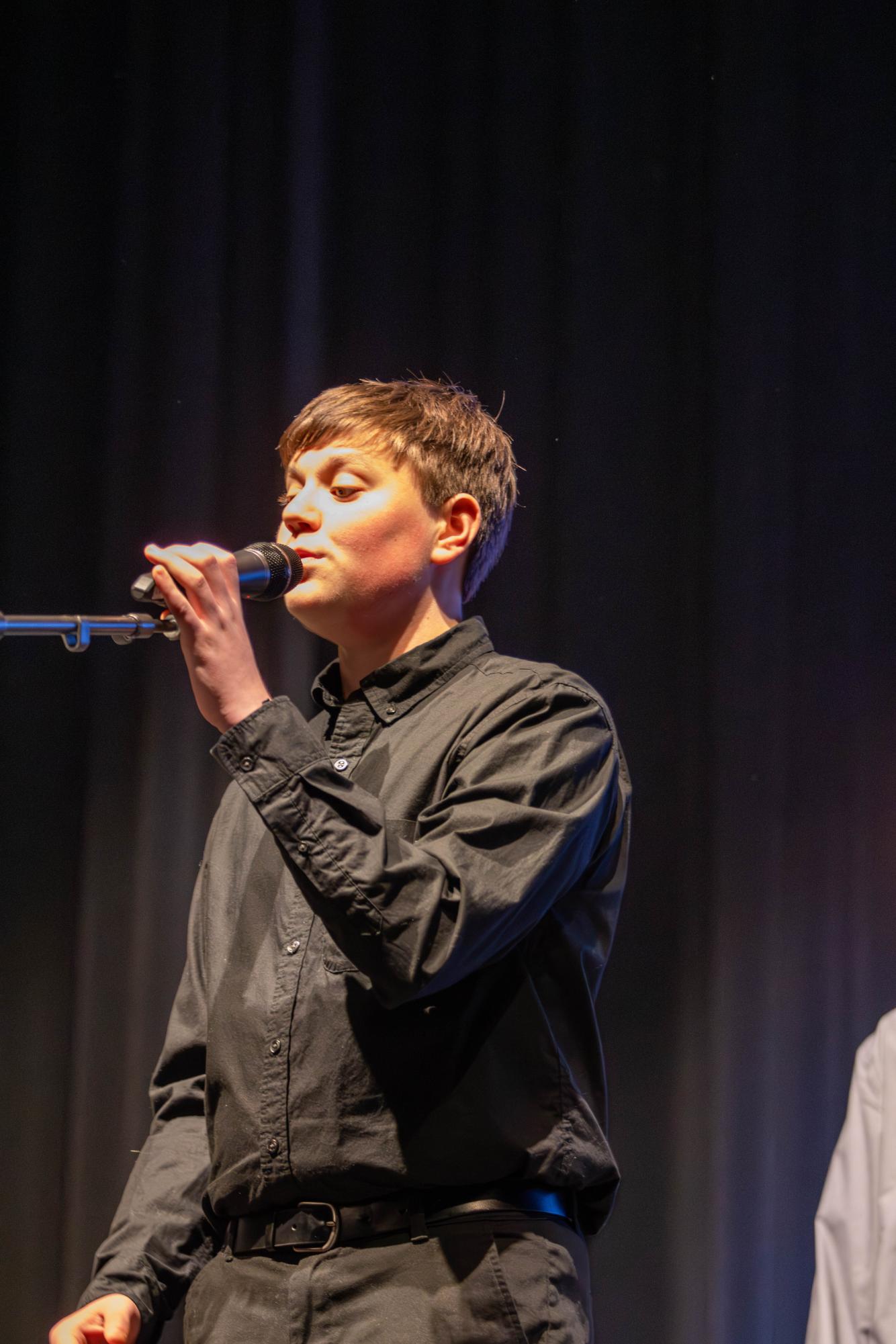 Cohen Roach performs a solo at the choir's winter concert.
