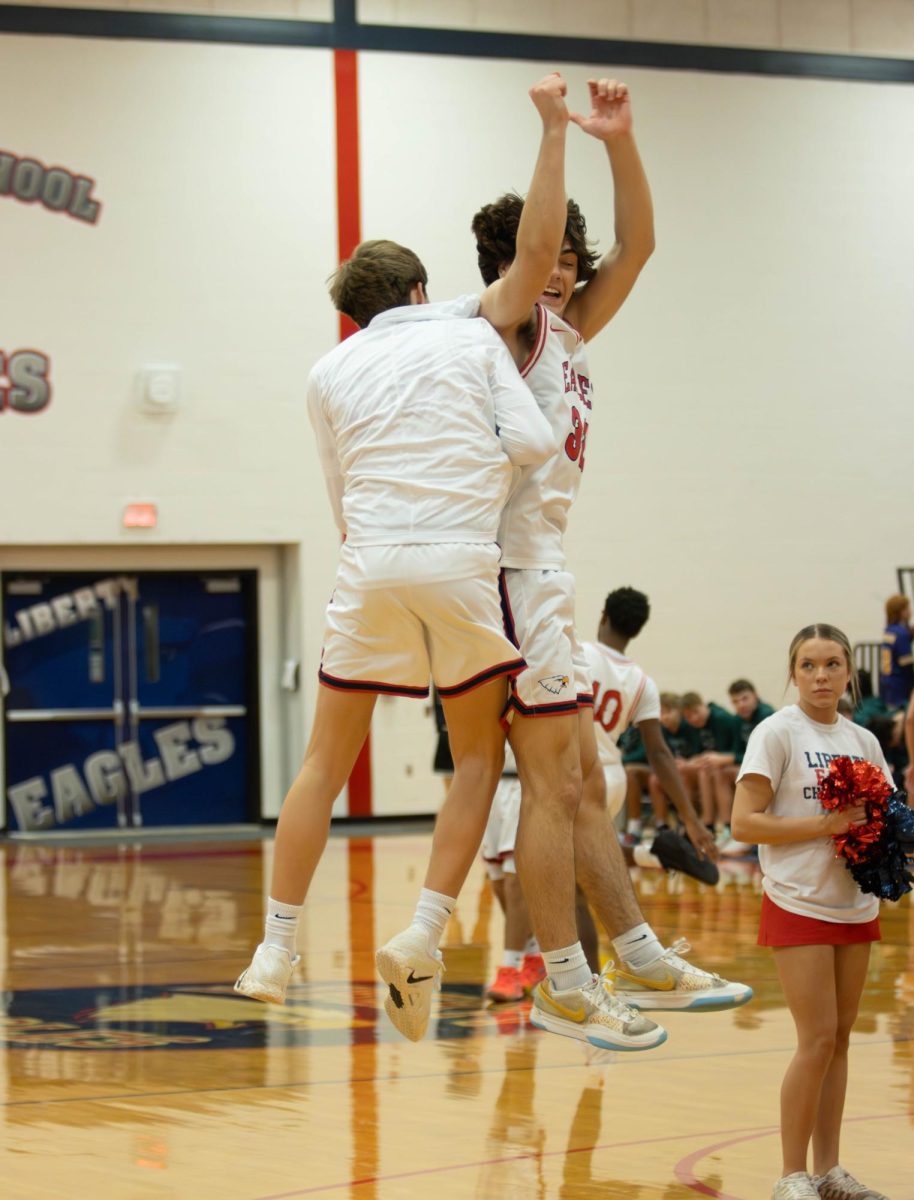 Landon Johnson #32 and Jackson Ryan #30 jump up together and hype each other up before the game against Orchard Farm on (12/09/25)