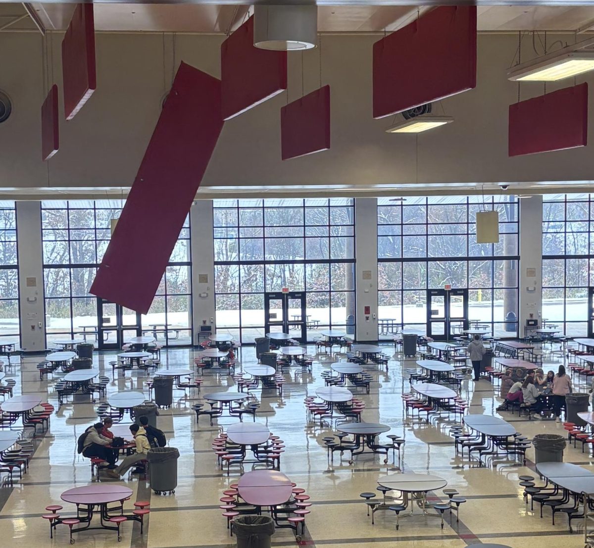 An acoustic ceiling panel loosely hangs in the cafeteria Tuesday morning. 