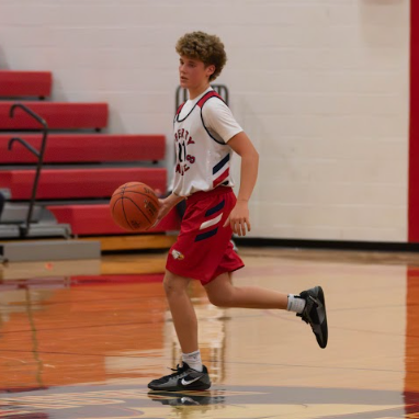 Brayden peck (9) dribbles  the ball up the court 