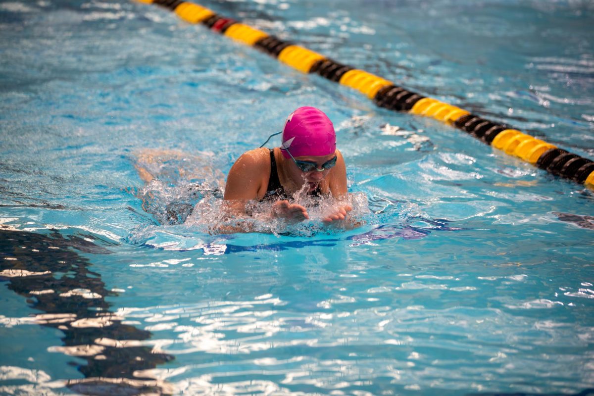 Brianna Petrova (9) takes a breath before going back down into the water. 