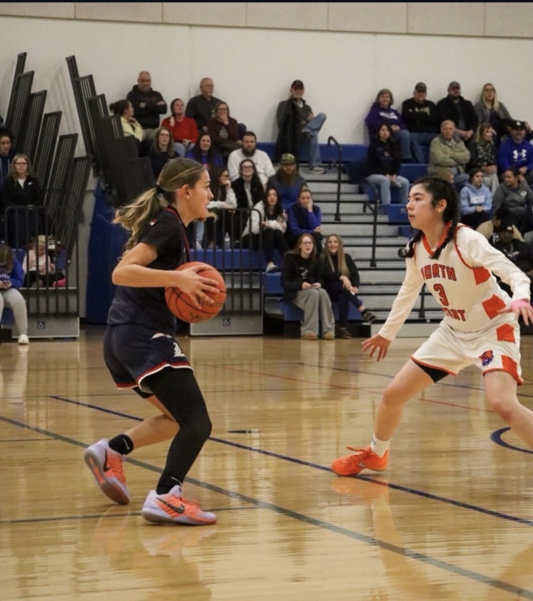 Macailyn Townsend (9) has possession of the ball in a game at North Point. 
