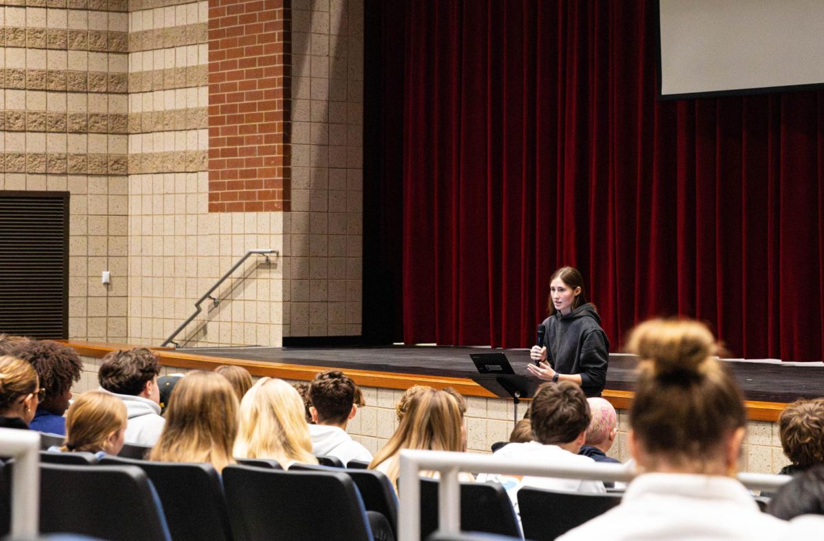 Hadley Kendall (11) speaks at the podium at a recent FCA meeting. 