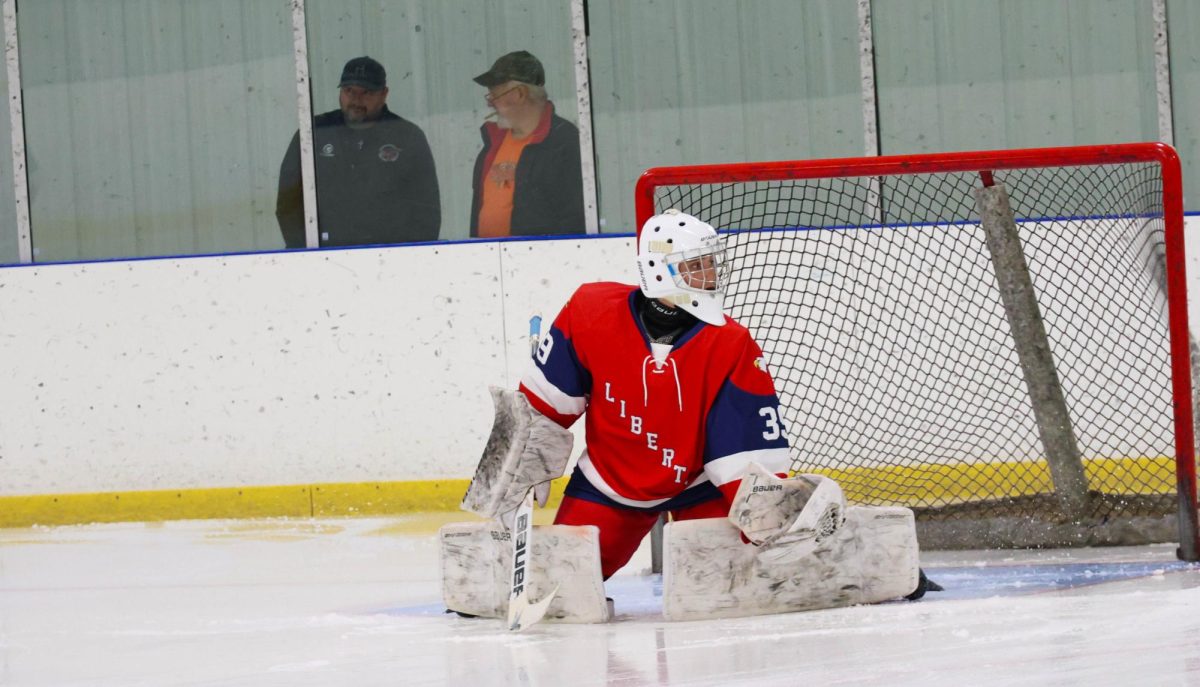 Brayden Dill (10) looks back after deflecting a puck during warm-ups.