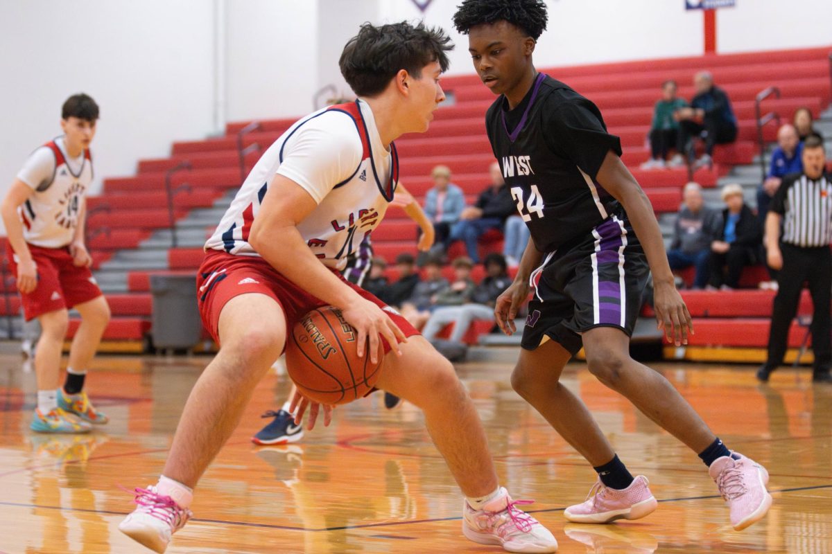Liam Heath (9) dribbles the ball between his legs against Zumwalt West. 