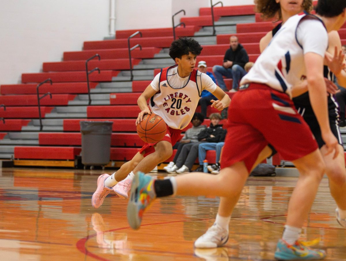Aaron Carlton (9) runs to the hoop and dribbles the ball. 