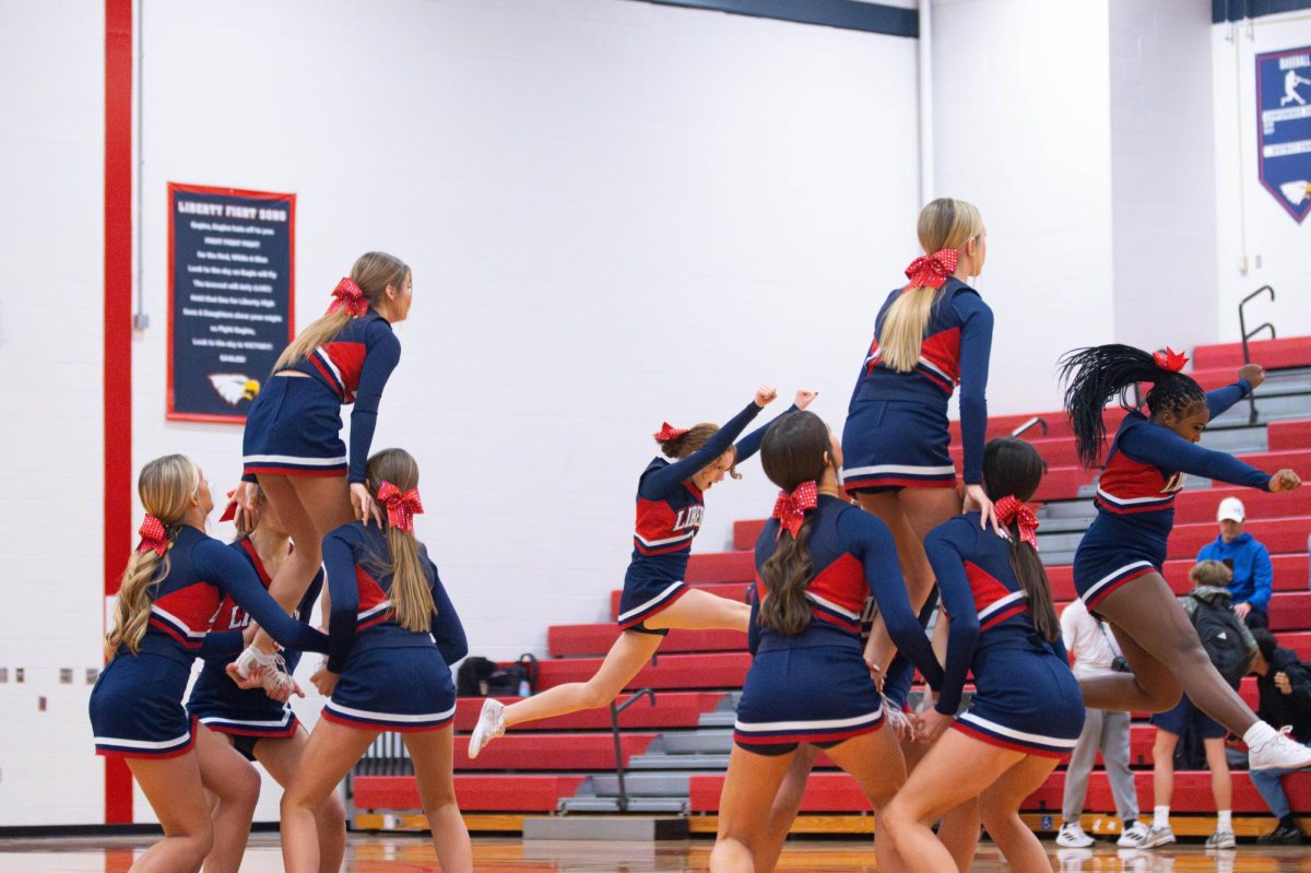 Freshman cheer team does a stunt during a halftime against Zumwalt West. 
