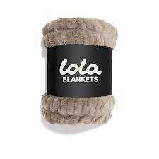 A Lola Blanket in the shade Desert Dune, shown its iconic packaging,