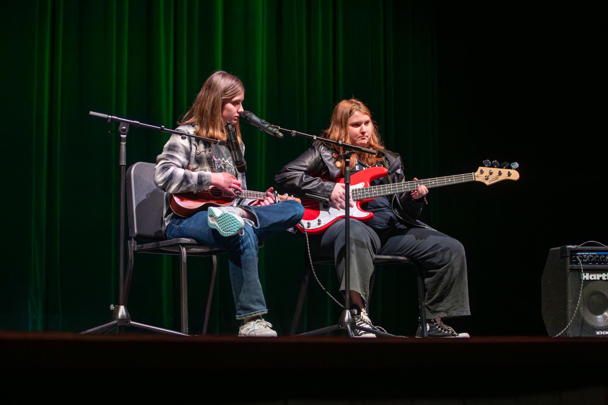 Brielle Vassel (11) and Cameryn Emberton (10) perform an original song together.