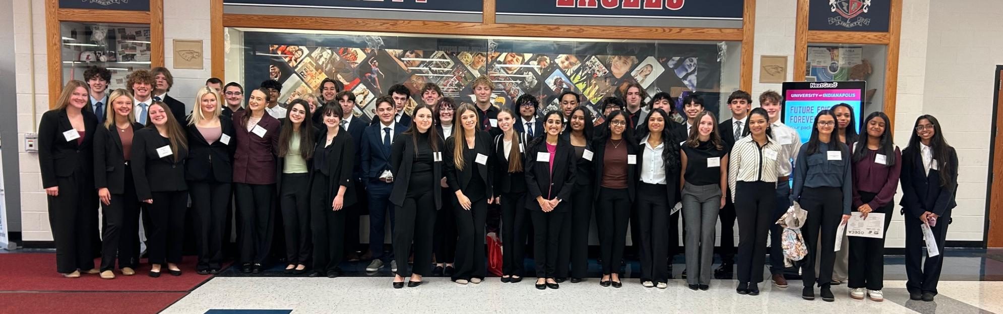 Students, donned in professional attire, gather before school to make the trip to their DECA District competition.