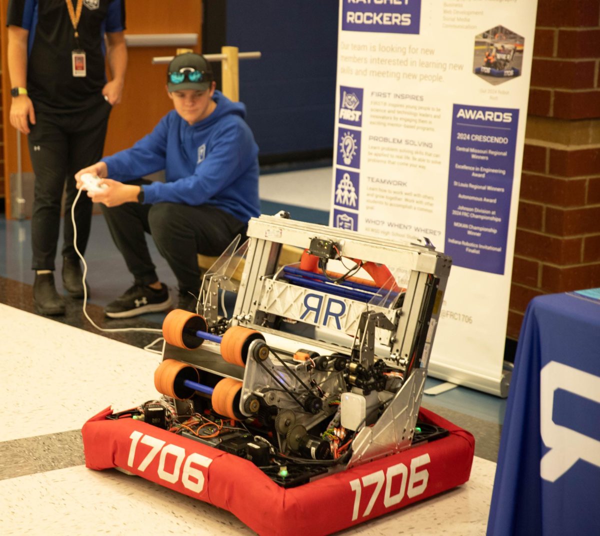 The Robotics Club shows off one of their robots to Eighth graders interested in the Robotics Club.