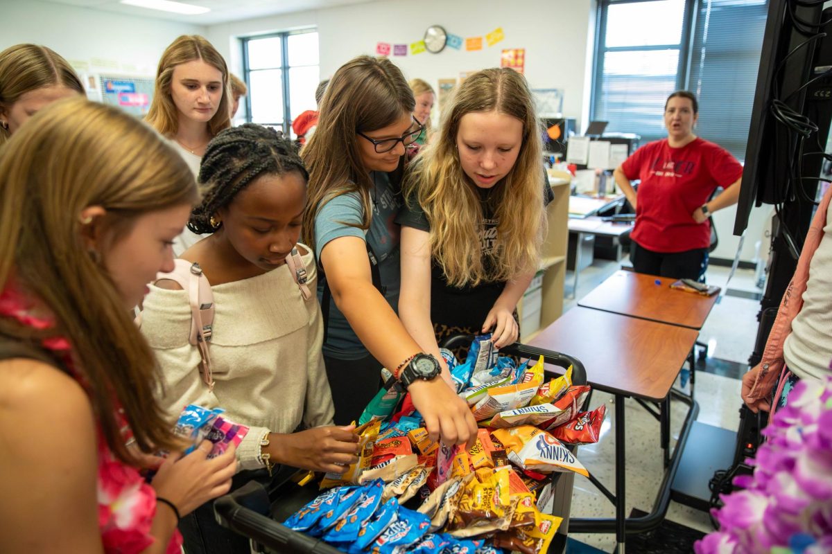 Every Friday, Student Council goes around the school and finds the most spirited classroom, which is the class that dresses the best towards the theme for that nights game, with a cart full of snacks. 