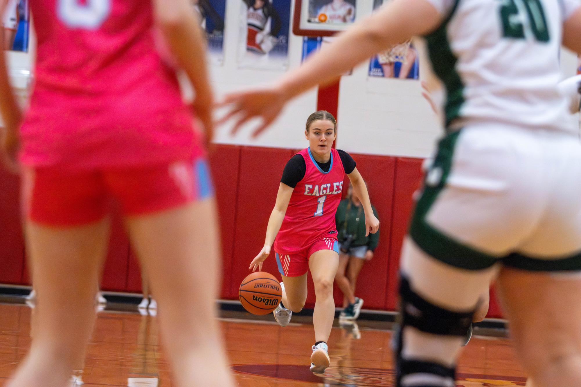 Reece Hoffman (11) runs down the court to set up the offense..