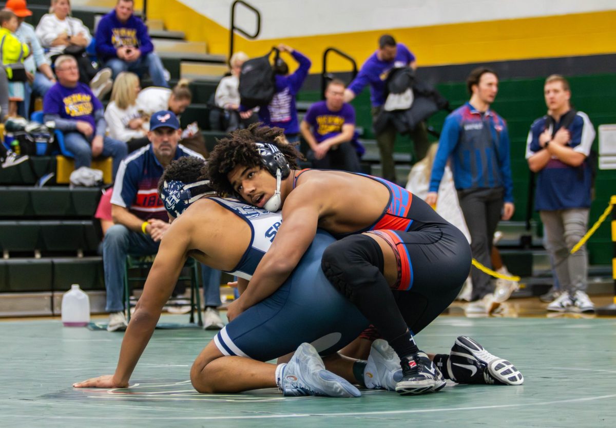 Maddoxx Jones (12) gets set up referees position on top and waits for the referee to blow the whistle so he can wrestle.