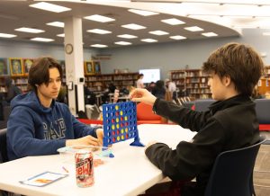 Champion Noah Spoor (9) places his chip during the second round of the Connect 4 tournament against Ian Blecher (10). 