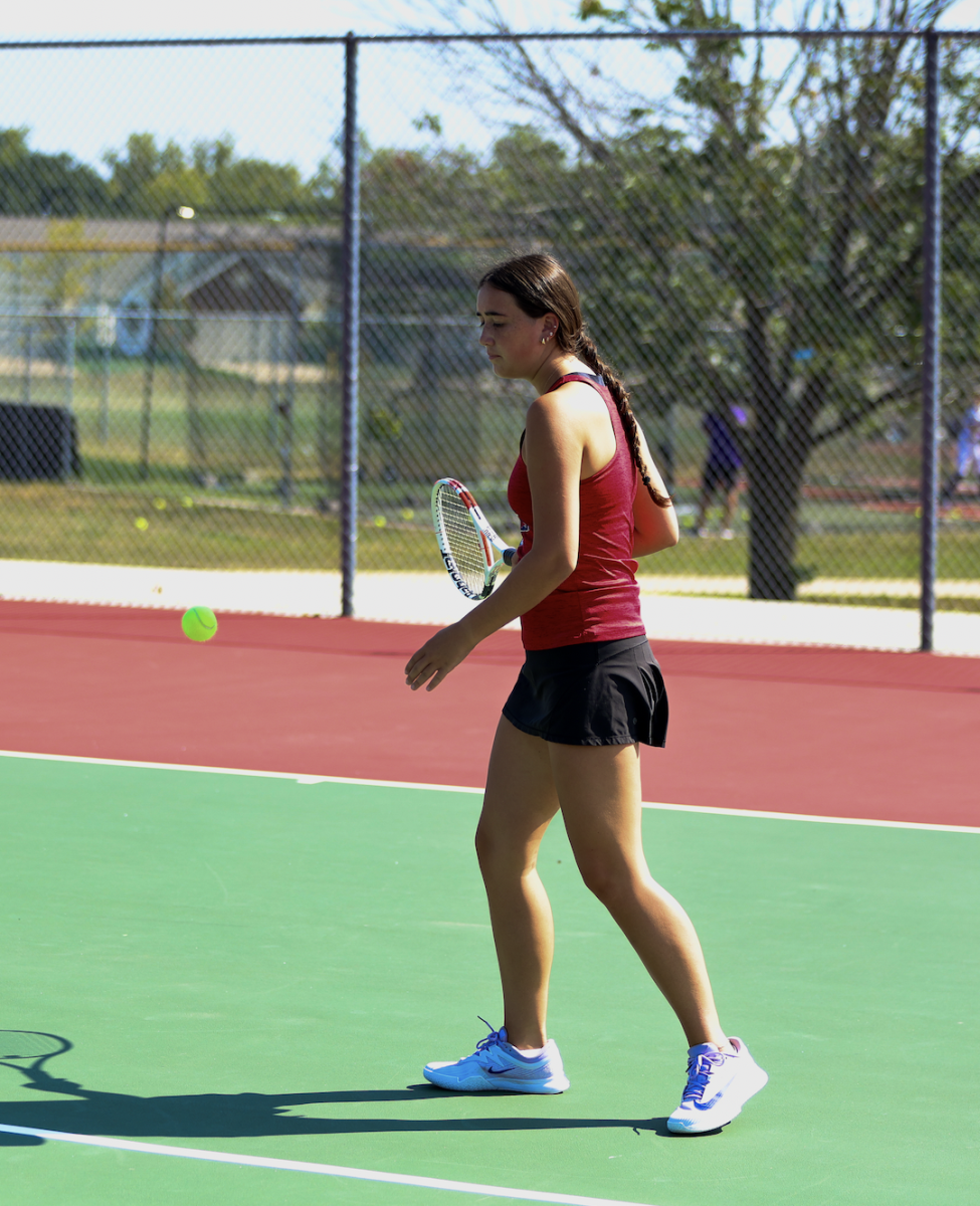 Sophia Gamm warms up for a long match against Fort Zumwalt West in the scorching heat.