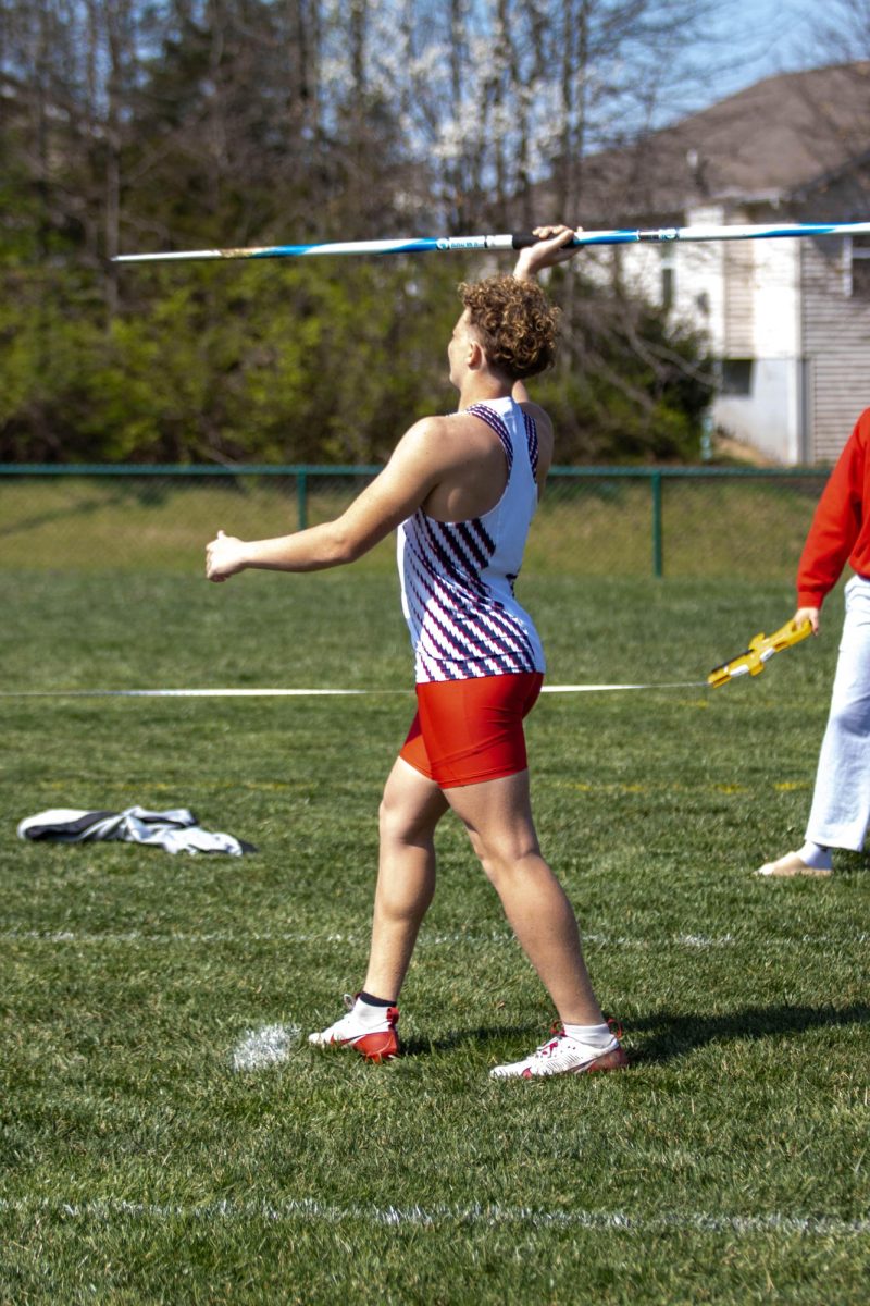 James Alexander (12) prepares to throw a javelin at a track meet last spring.
