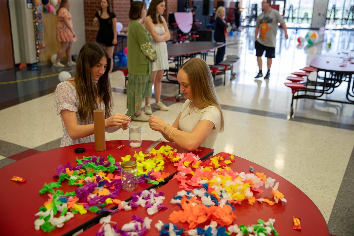 Olivia Fehling (12) and Caroline Blankenship (11) help to prepare for the all of us dance.